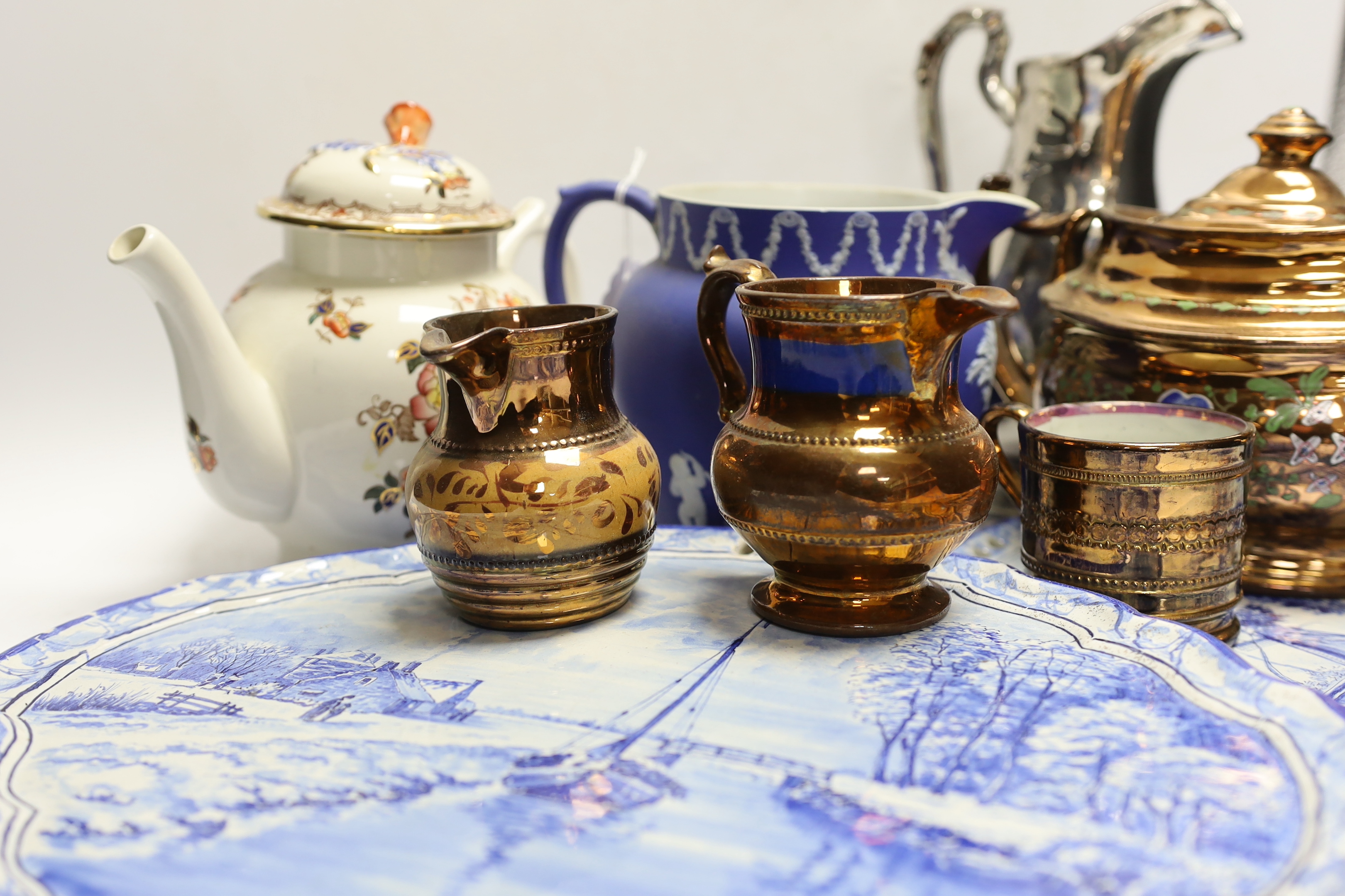 Nine ceramic items including two Dutch blue and white wall plaques, a silvered jug, a teapot, four items of lustreware and a Wedgwood jug, tallest 23cm